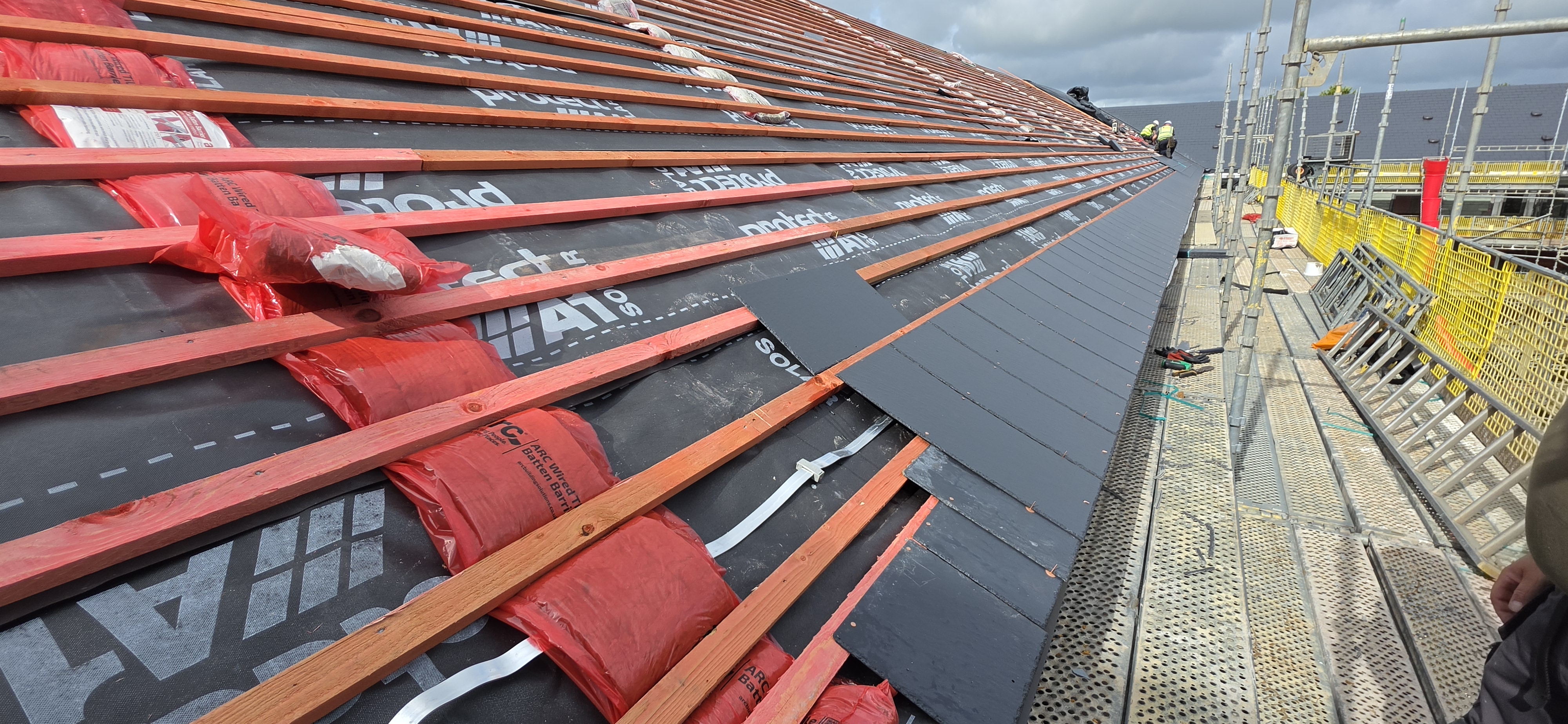 Roof covering and batten installation during remediation at The Courtyards