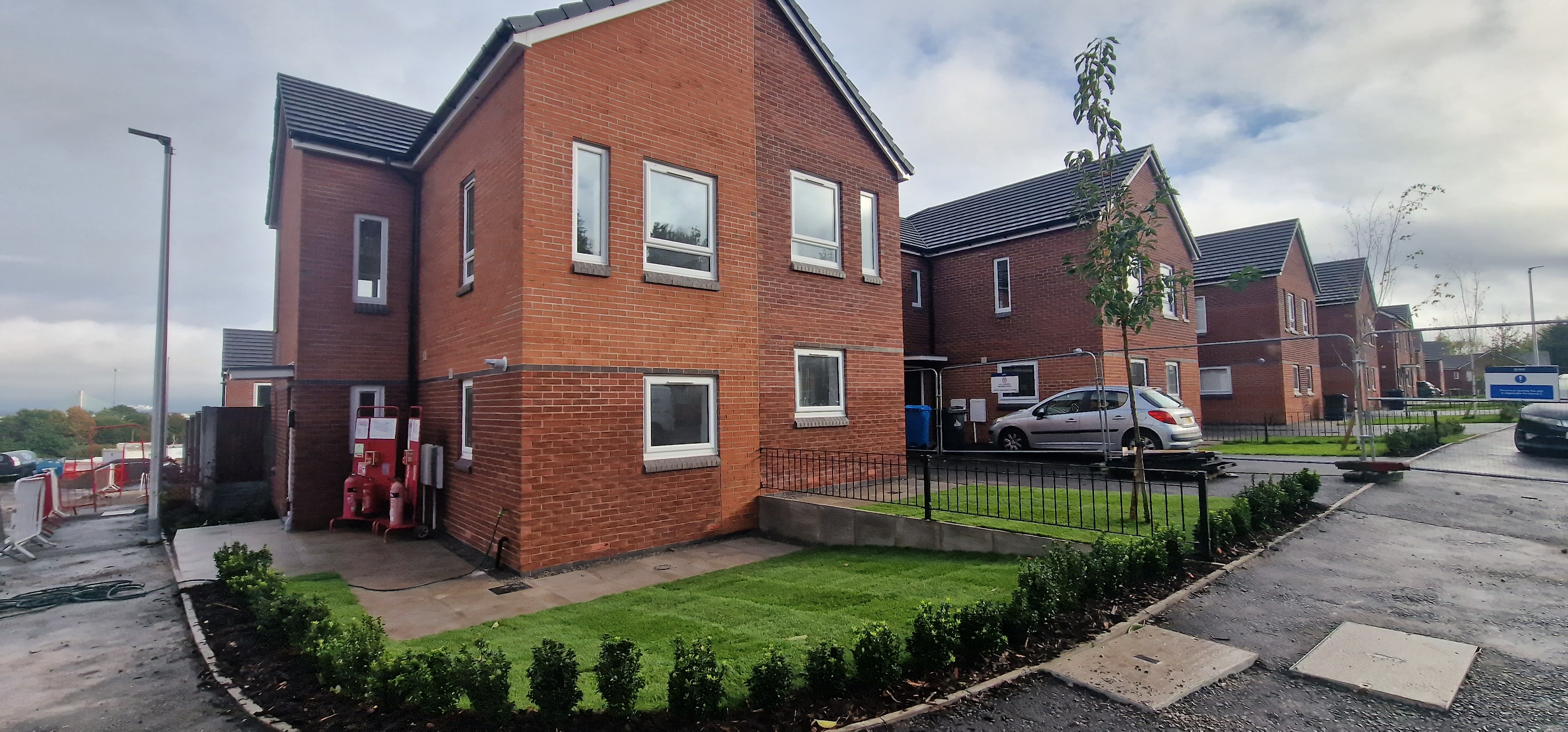 Homes and landscaping during the later stages of work at Halton Court