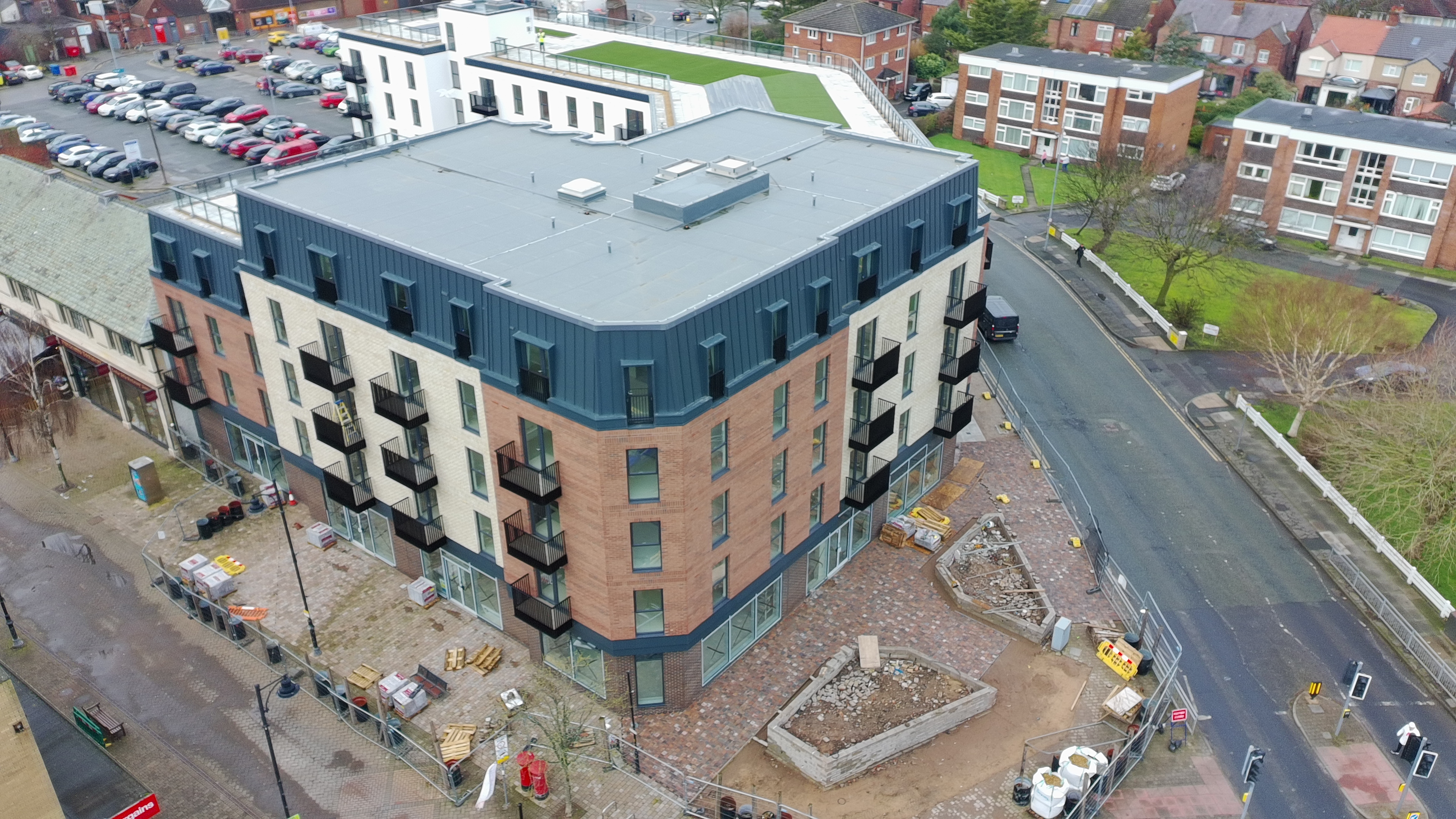 Corner elevation and external works at Moorside Place