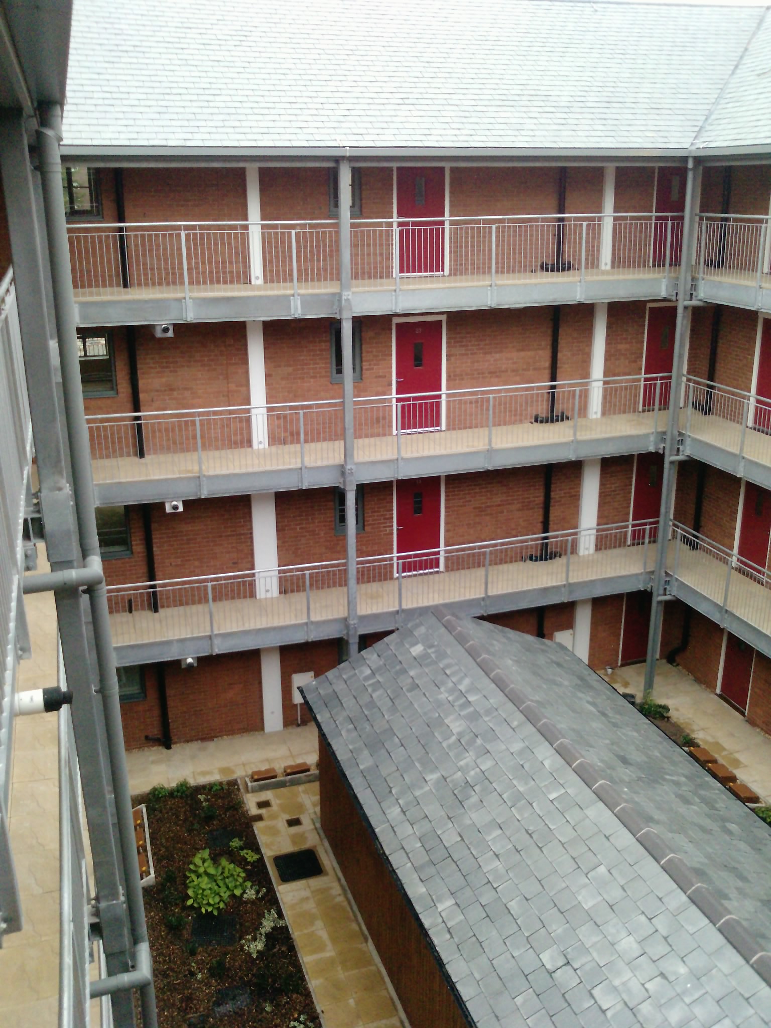 Upper-floor access galleries around the courtyard at Old Post Office, Chester