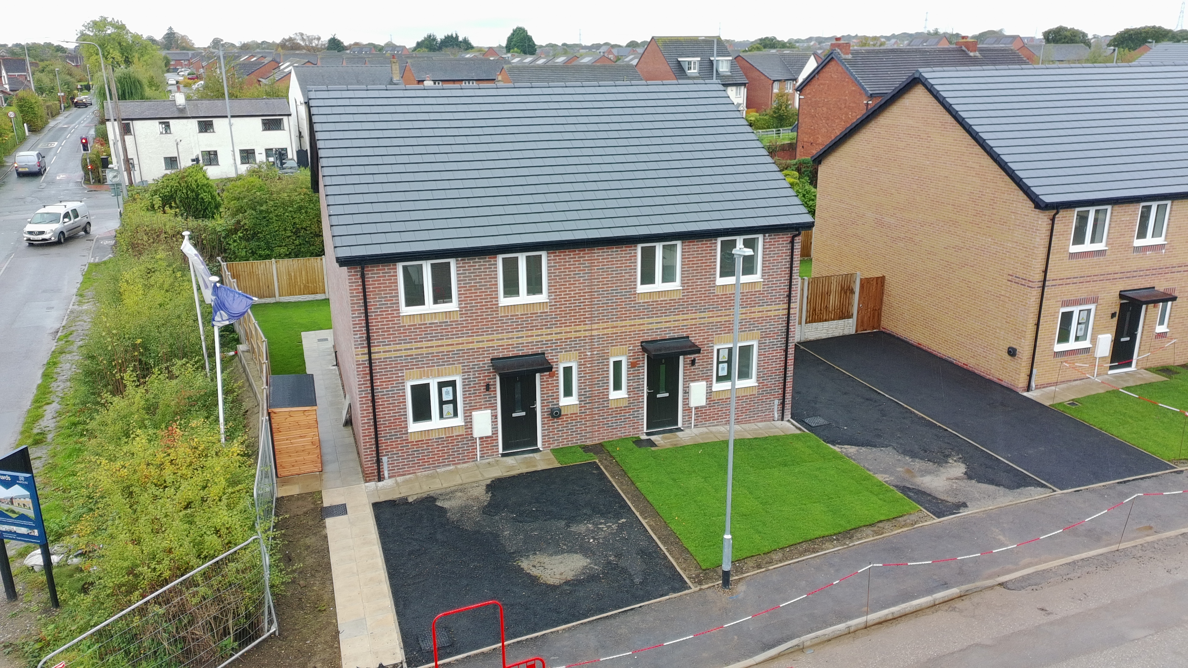 New semi-detached homes and front gardens at The Orchids