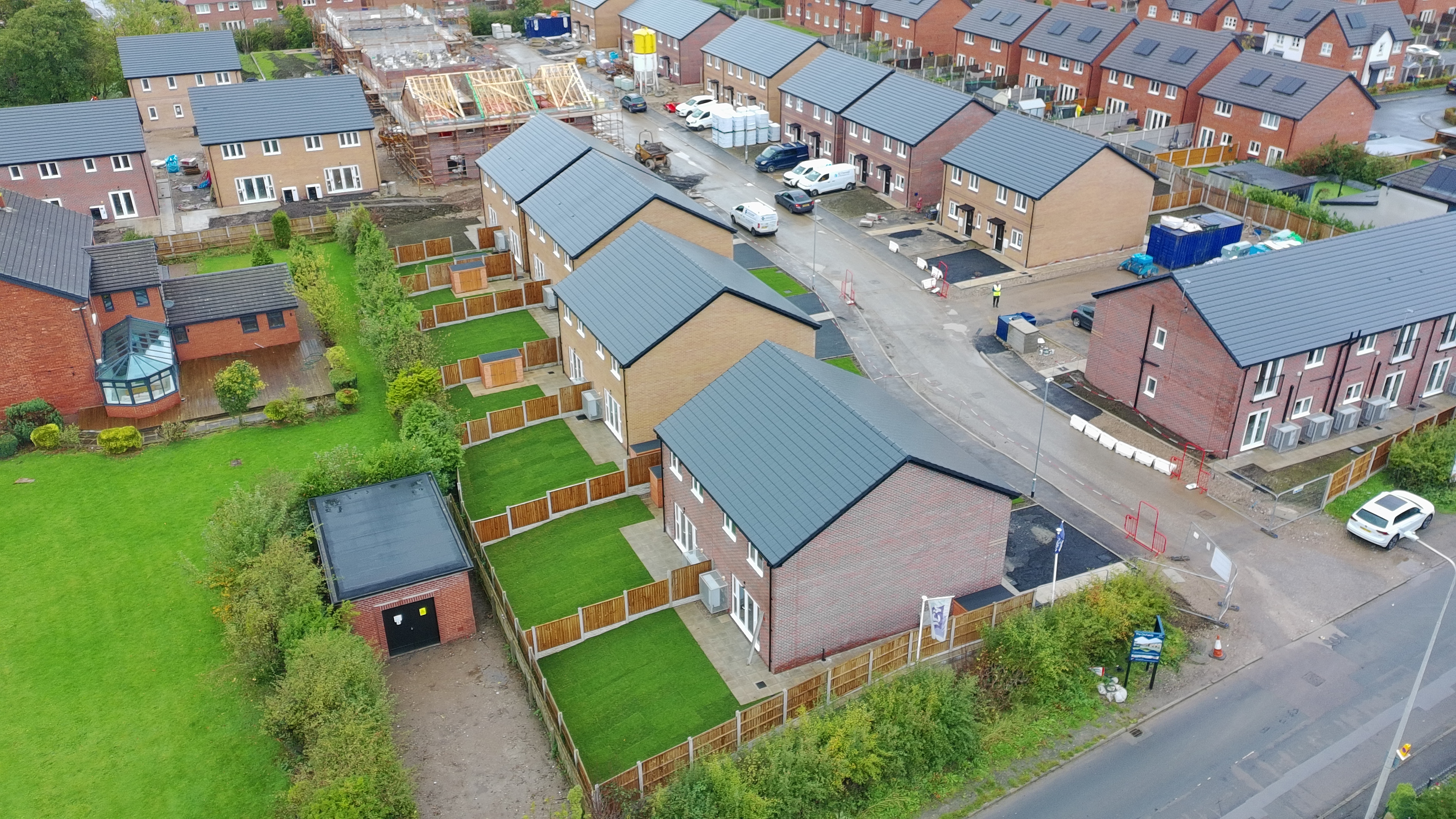 Aerial view of homes and rear gardens at The Orchids