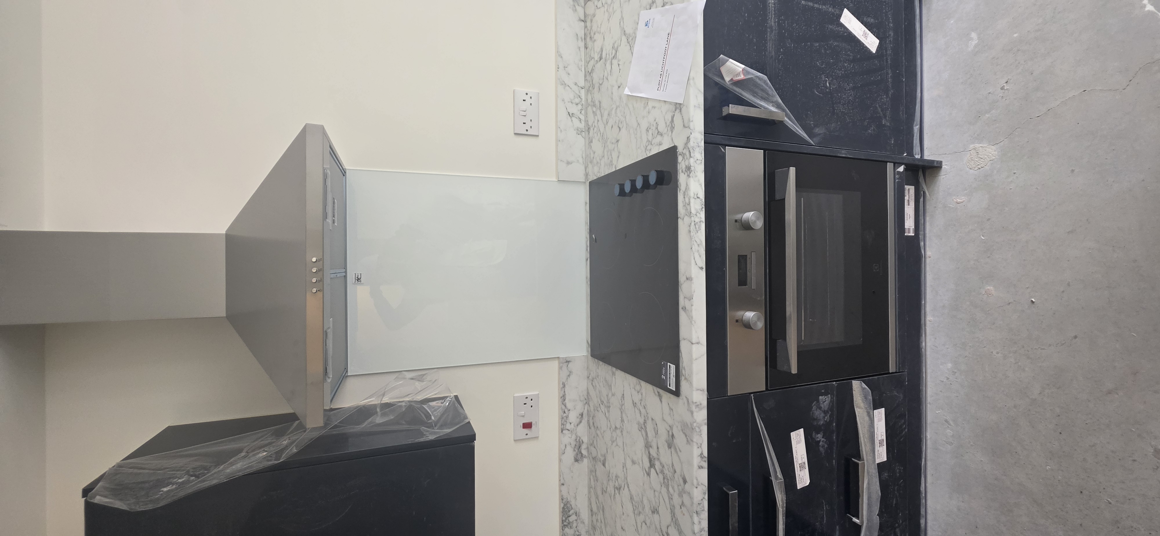 Kitchen appliances and worktop during finishing works at The Orchids