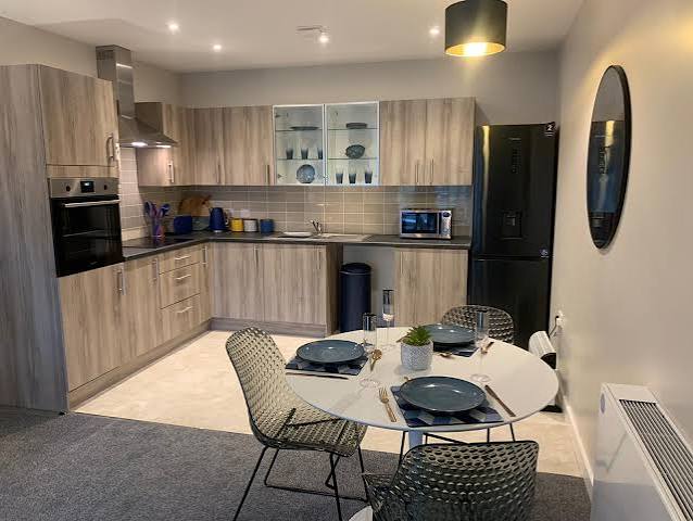 Apartment kitchen and dining space at Poppyfields